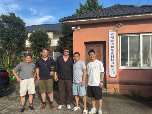 Company founder and general manager take a photo with Polish clients