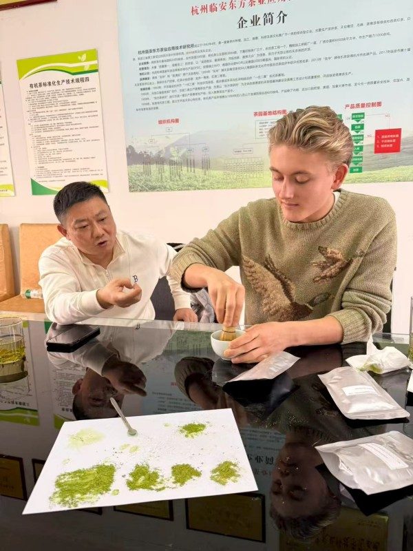 Alex is showing the guests how to brew matcha properly