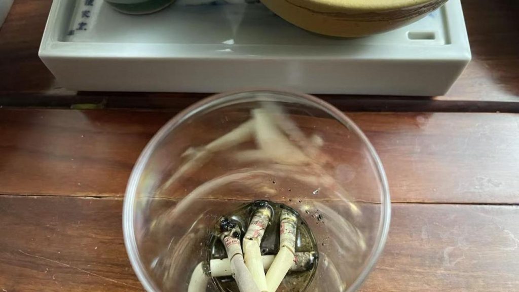 The cigarette butt Alex left after smoking the next day